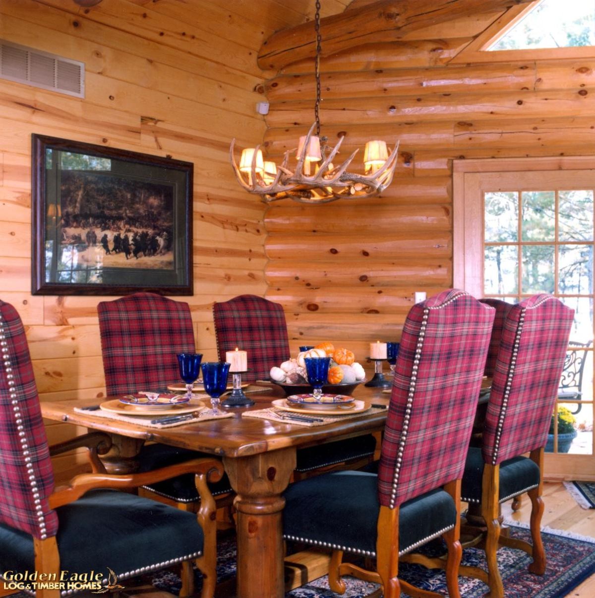 red plaid upholstered chairs around dining table