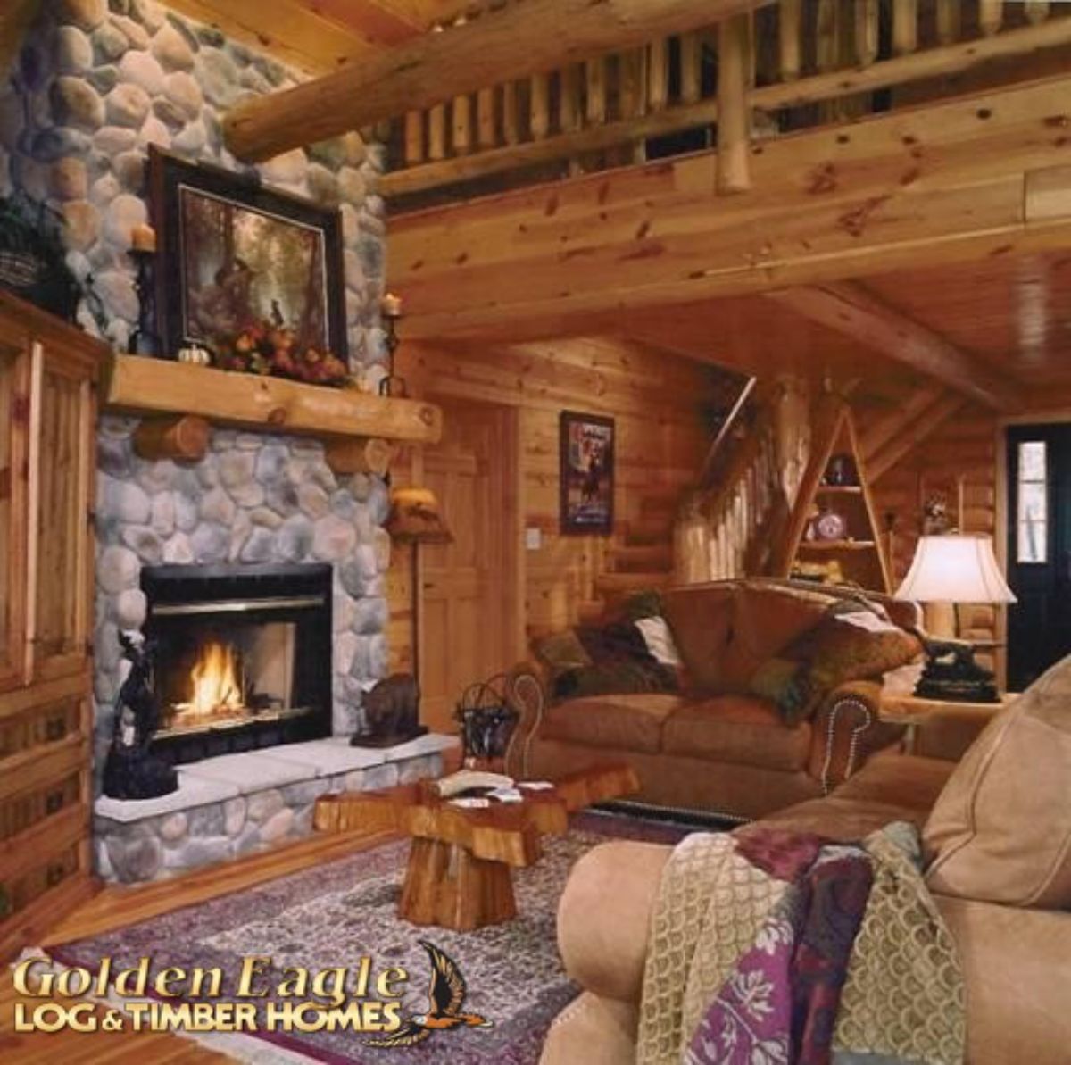 fireplace in front of sofa in log cabin great room