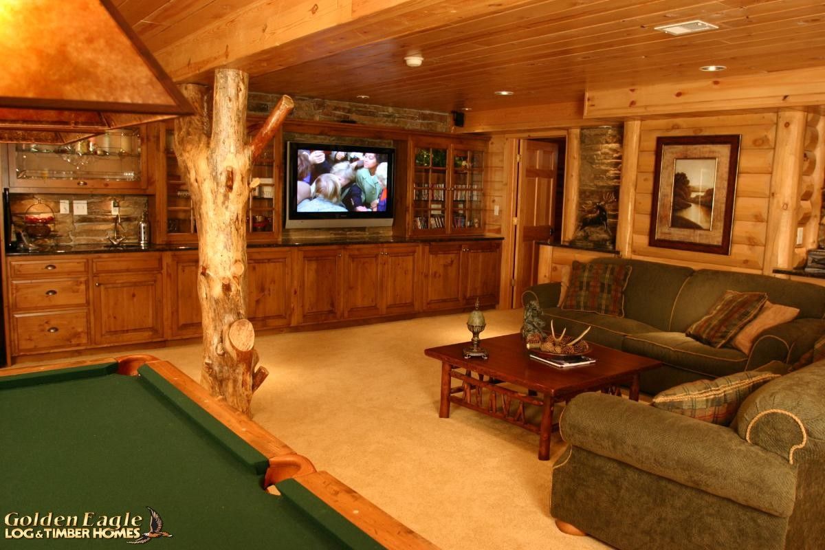 basement with pool table on left and sofa on right