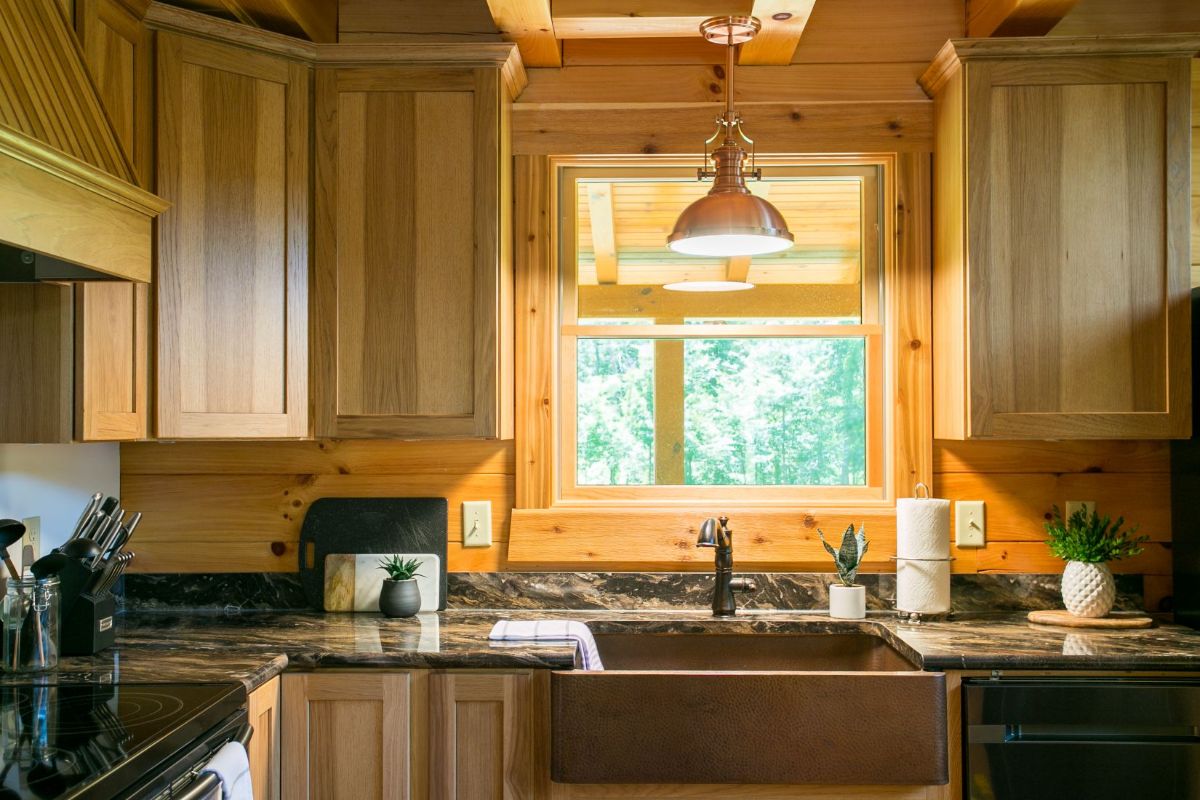 kitchen with wood cabinets and sink below window