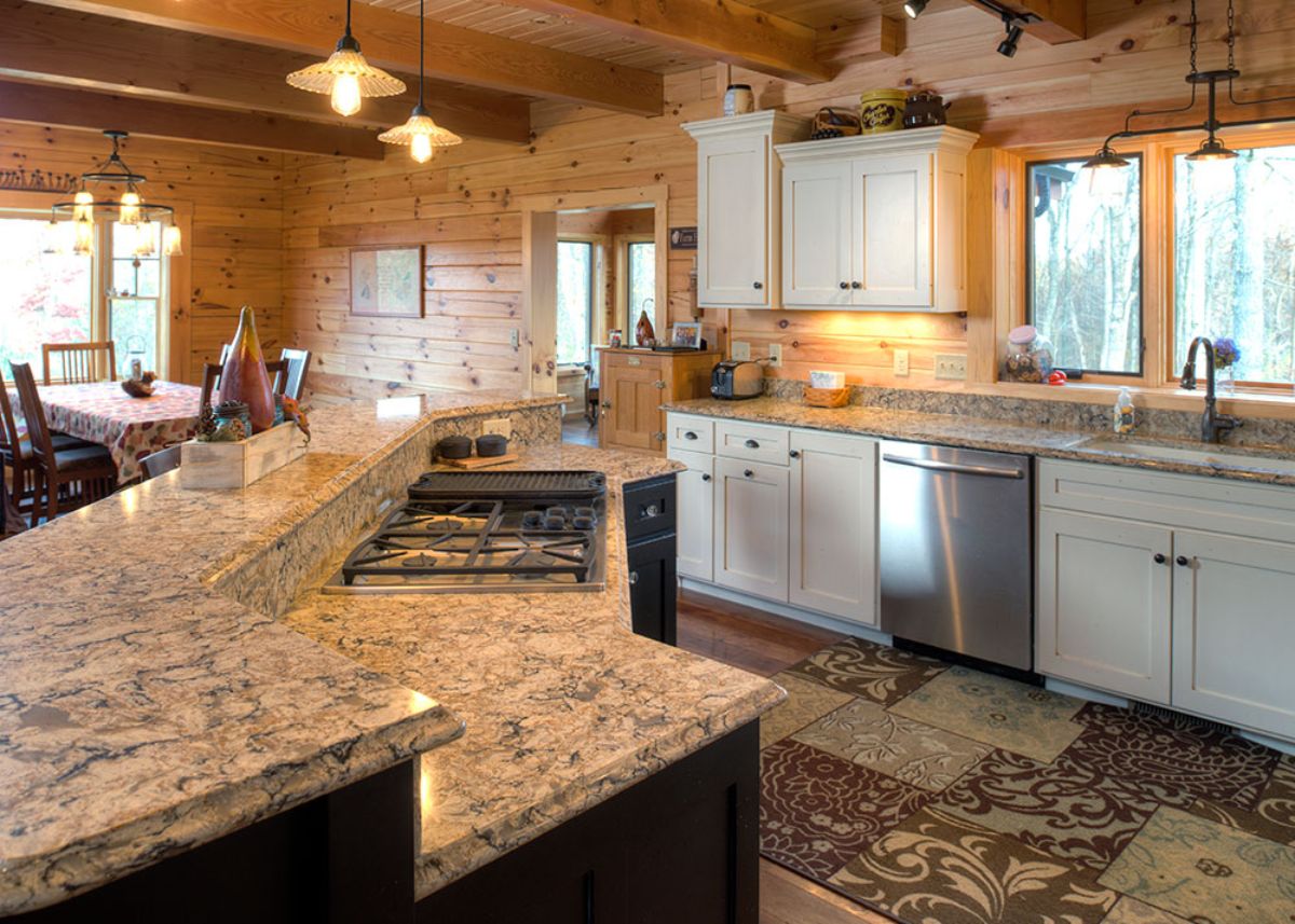 light granite countertop in kitchen with white cabinets