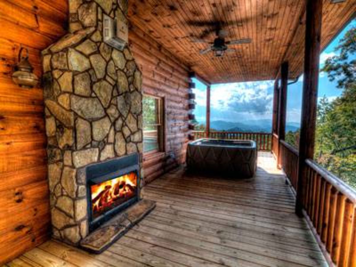 fireplace on porch by hot tub