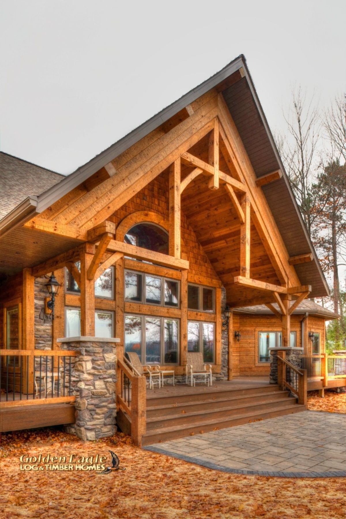 wood steps up to back wall of windows on log cabin