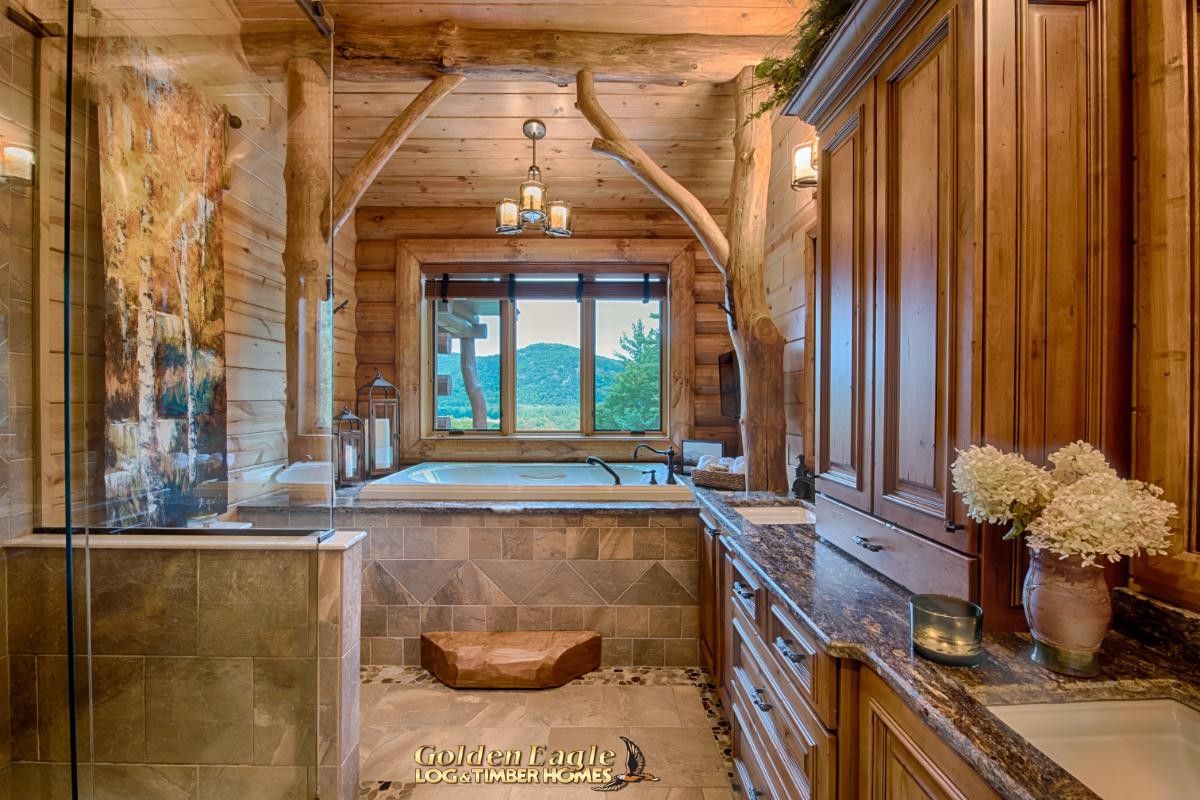 jacuzzi tub against window in log bathroom