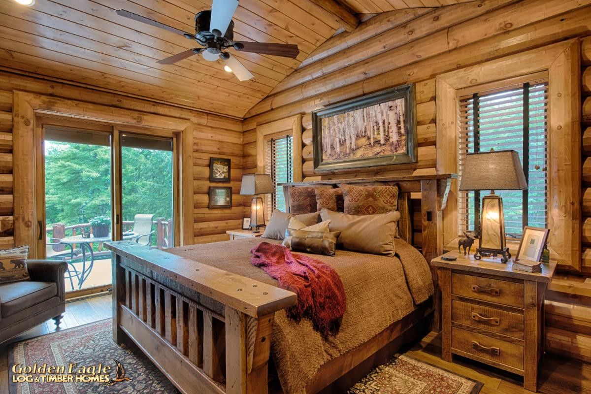 bed with log frame against wall with french doors on left