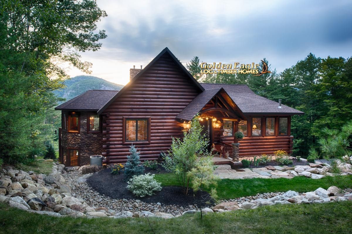 log cabin with rock path to door