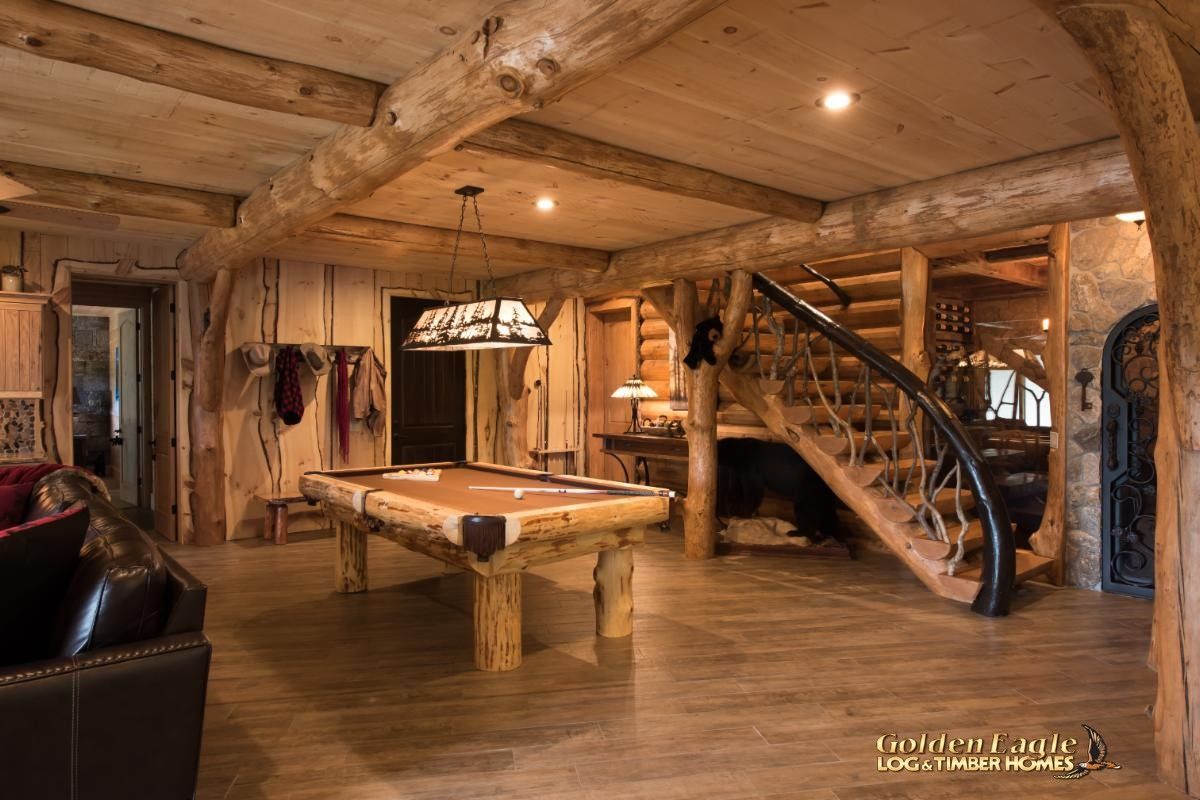 wood pool table in basement with stairs to background