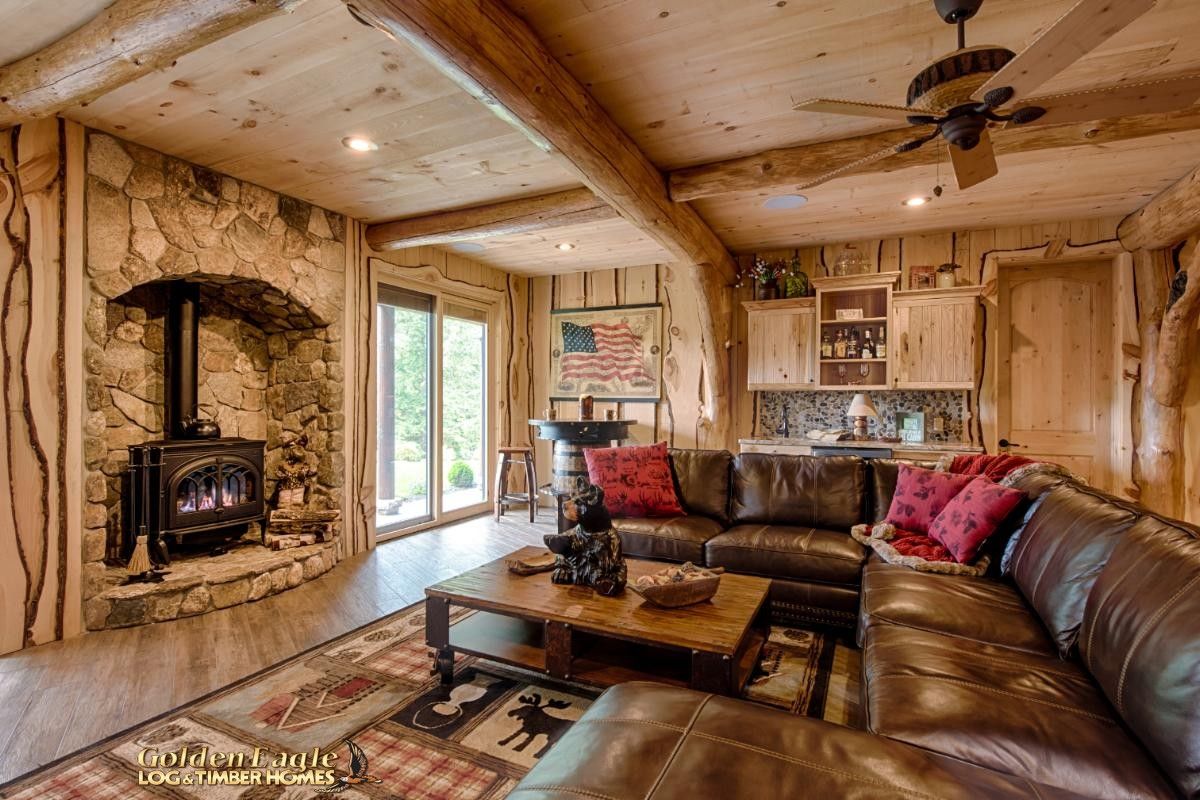 black wood stove in basement next to glass french doors