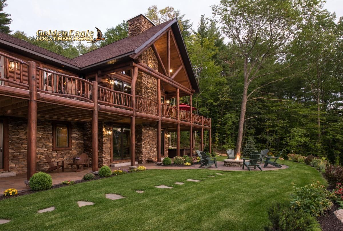 back of log cabin with deck over walkout basement