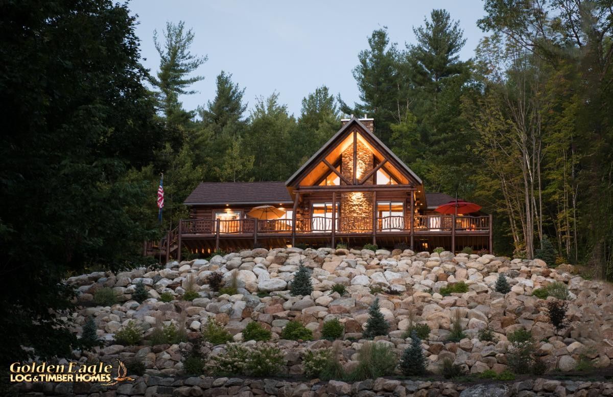 view of back of log cabin from water