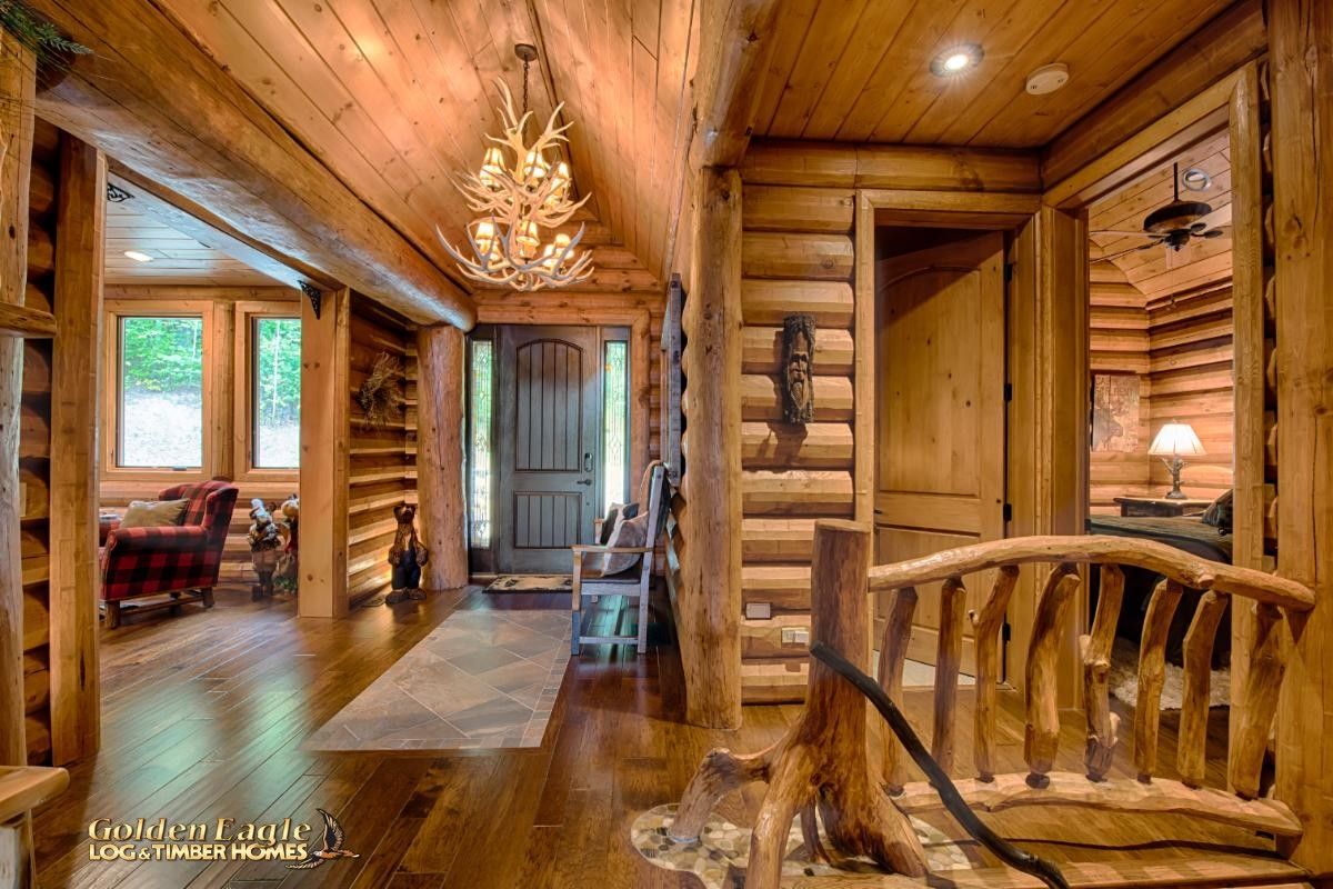 entry to log cabin with stairway to right