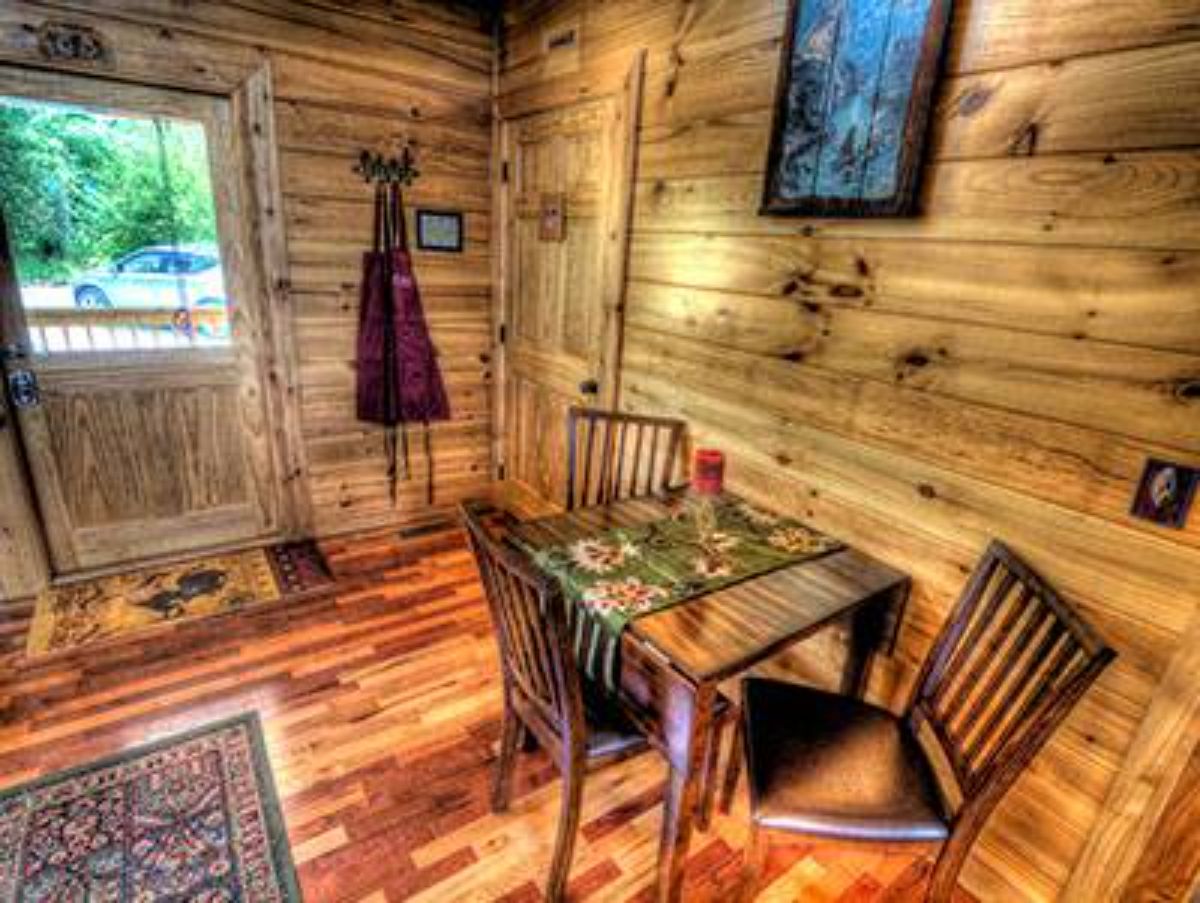 two person table against wall beneath picture