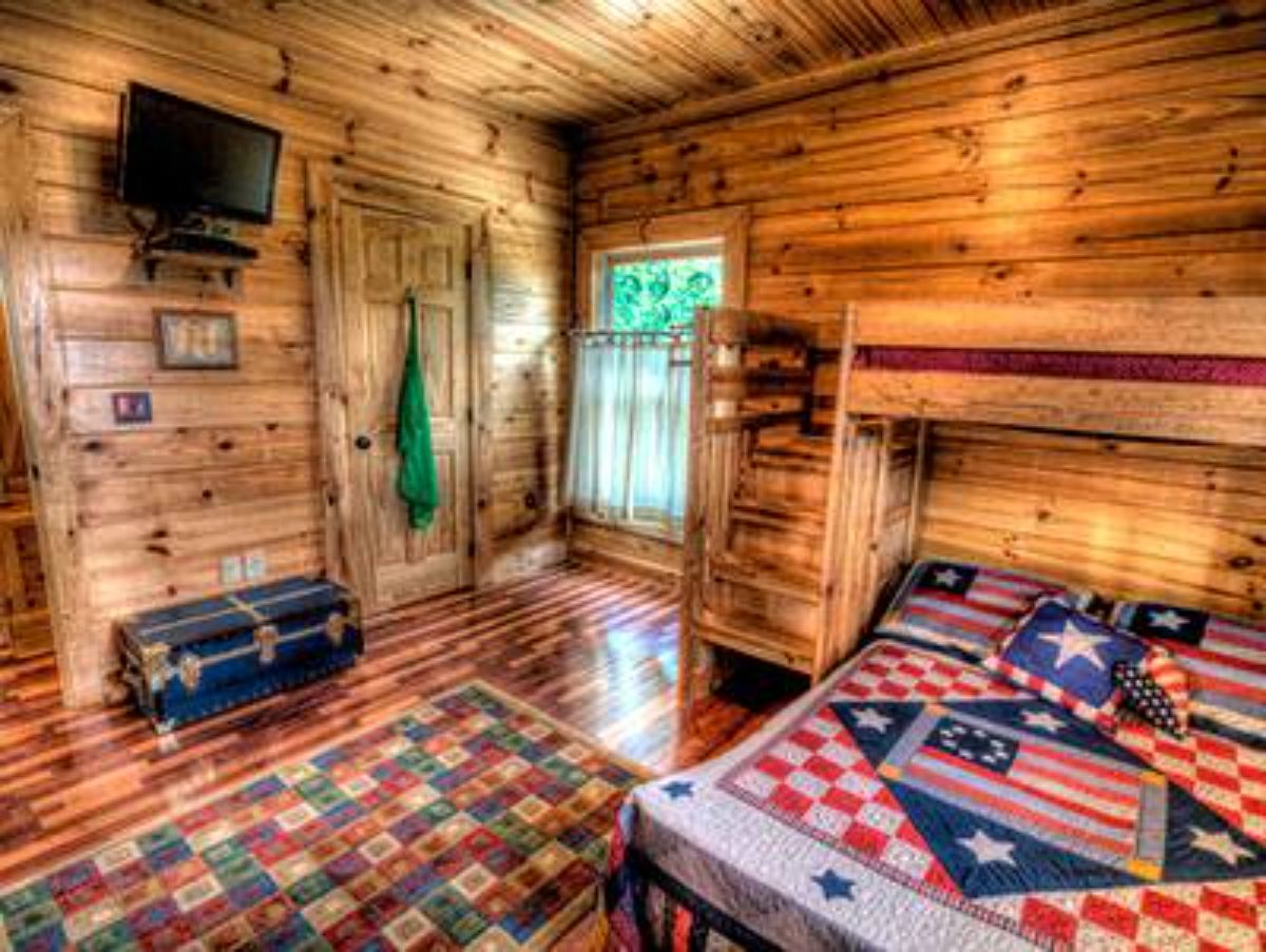 Americana tedspread with dark wood walls on all sides