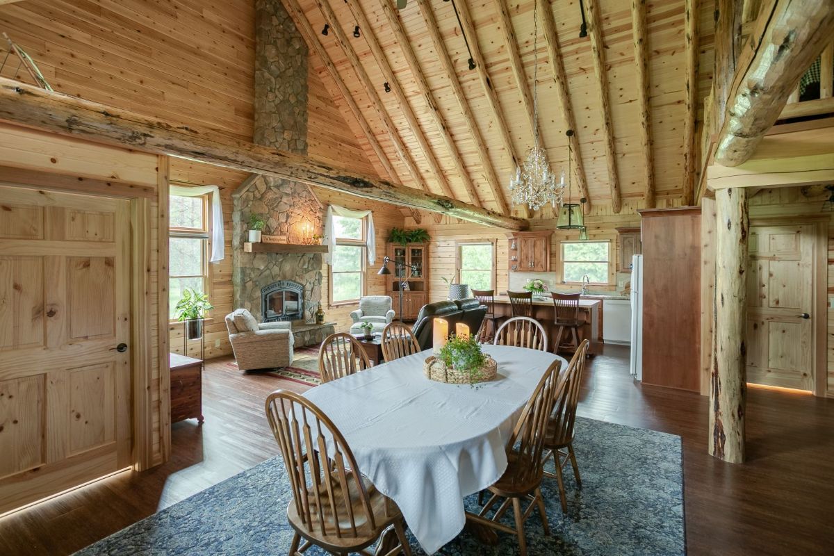 white linens on table in log cabin