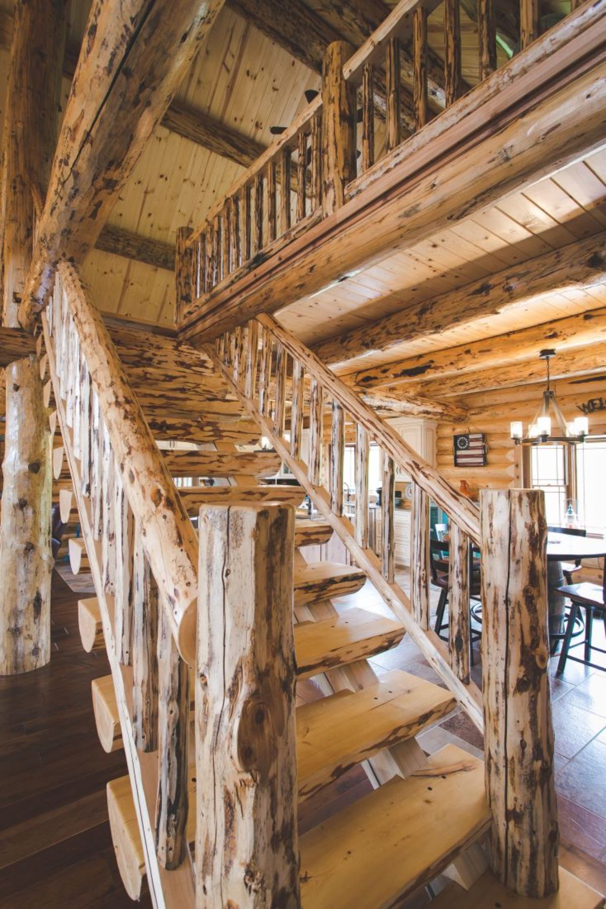 close up view of log loft stairs with log railing