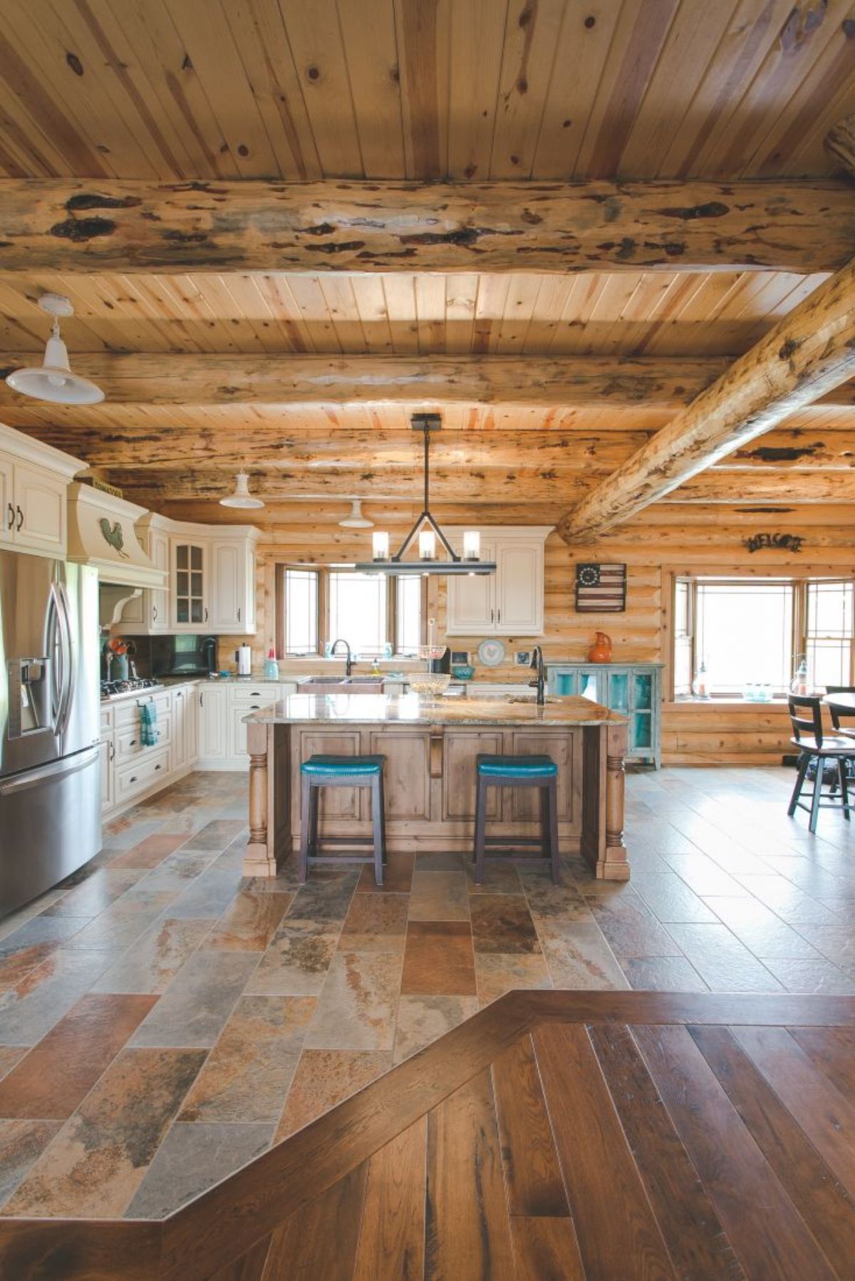 teal stools at island bar in kitchen