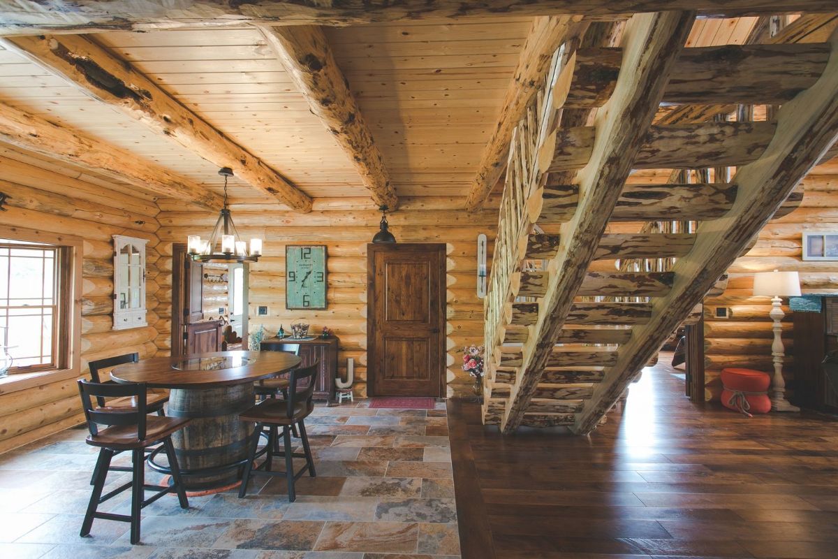 view of dining table underneath loft stairs