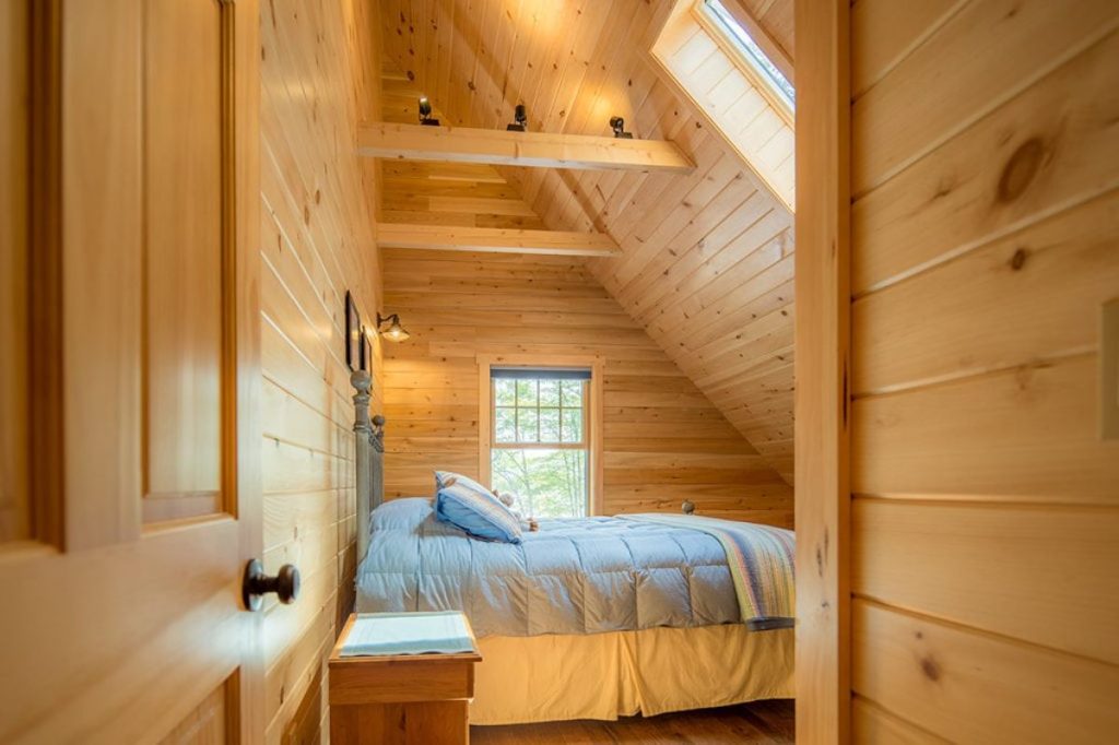 wooden door open looking into bedroom