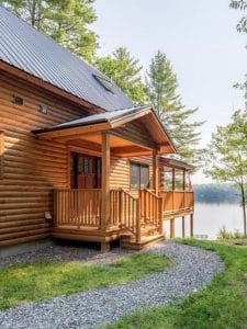 small porch on side of log cabin