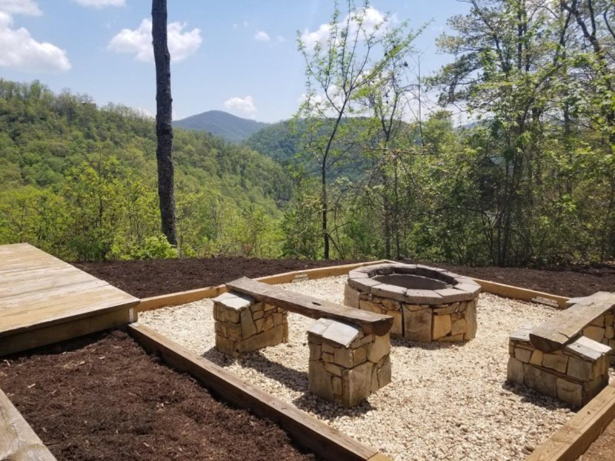 firepit with gravel base and wood rock combination benches on each side