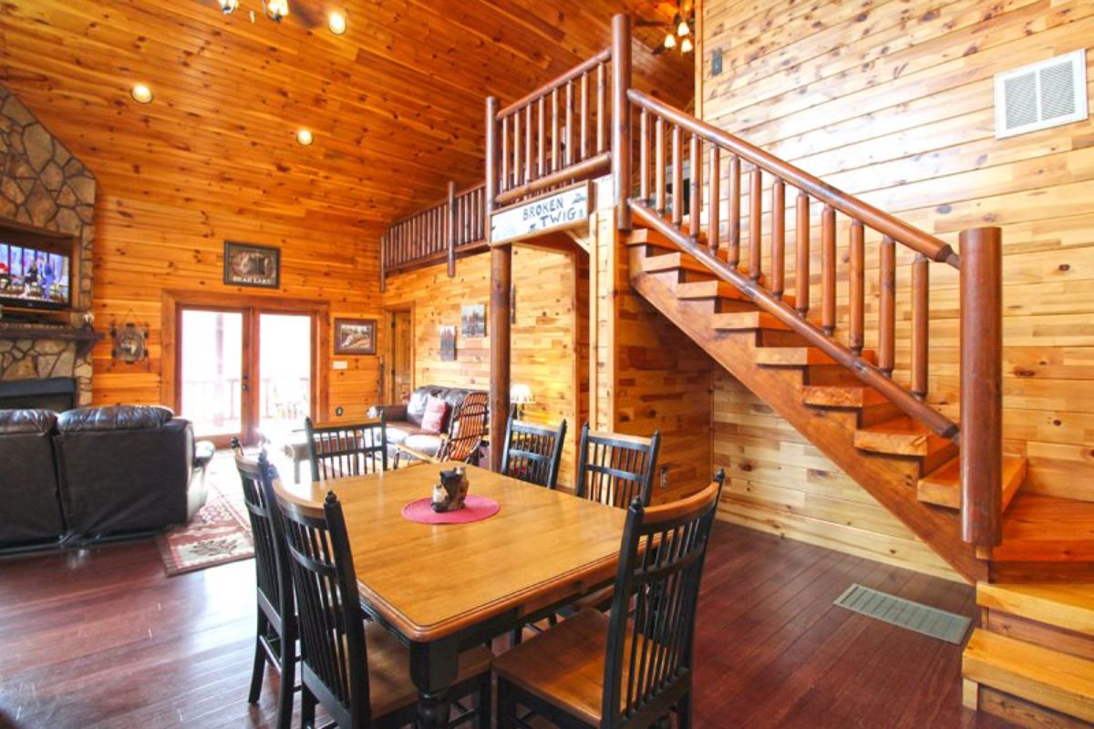 dining table next to stairs to loft