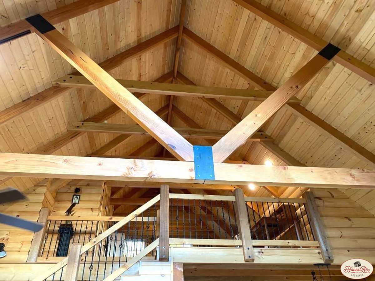 log beams above great room in log cabin