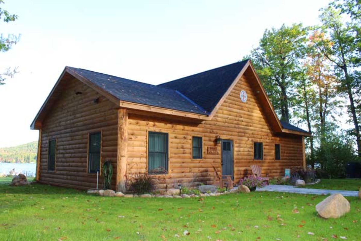 log cabin with stone landscaping