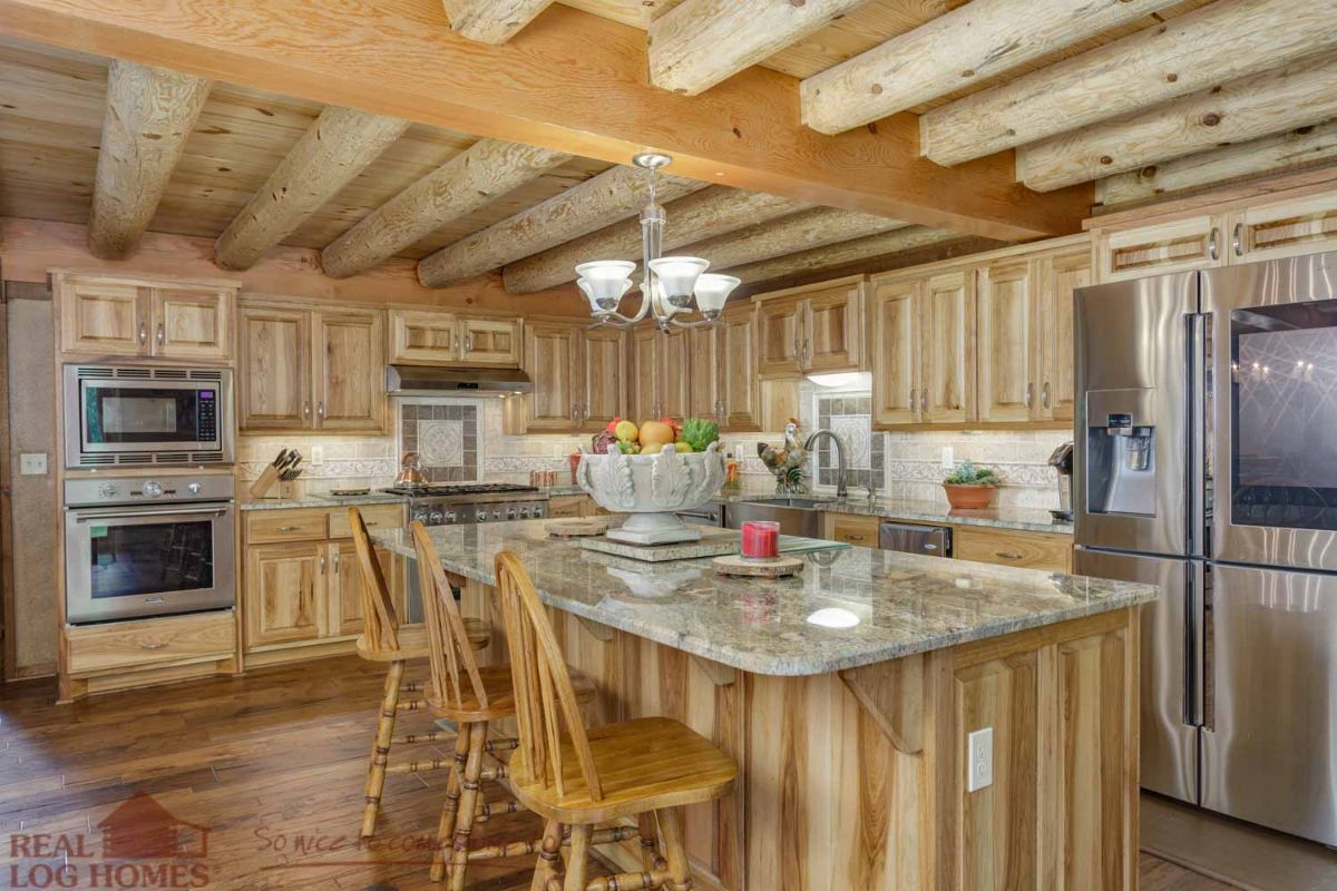 log cabin kitchen with island bar holding light wood stools