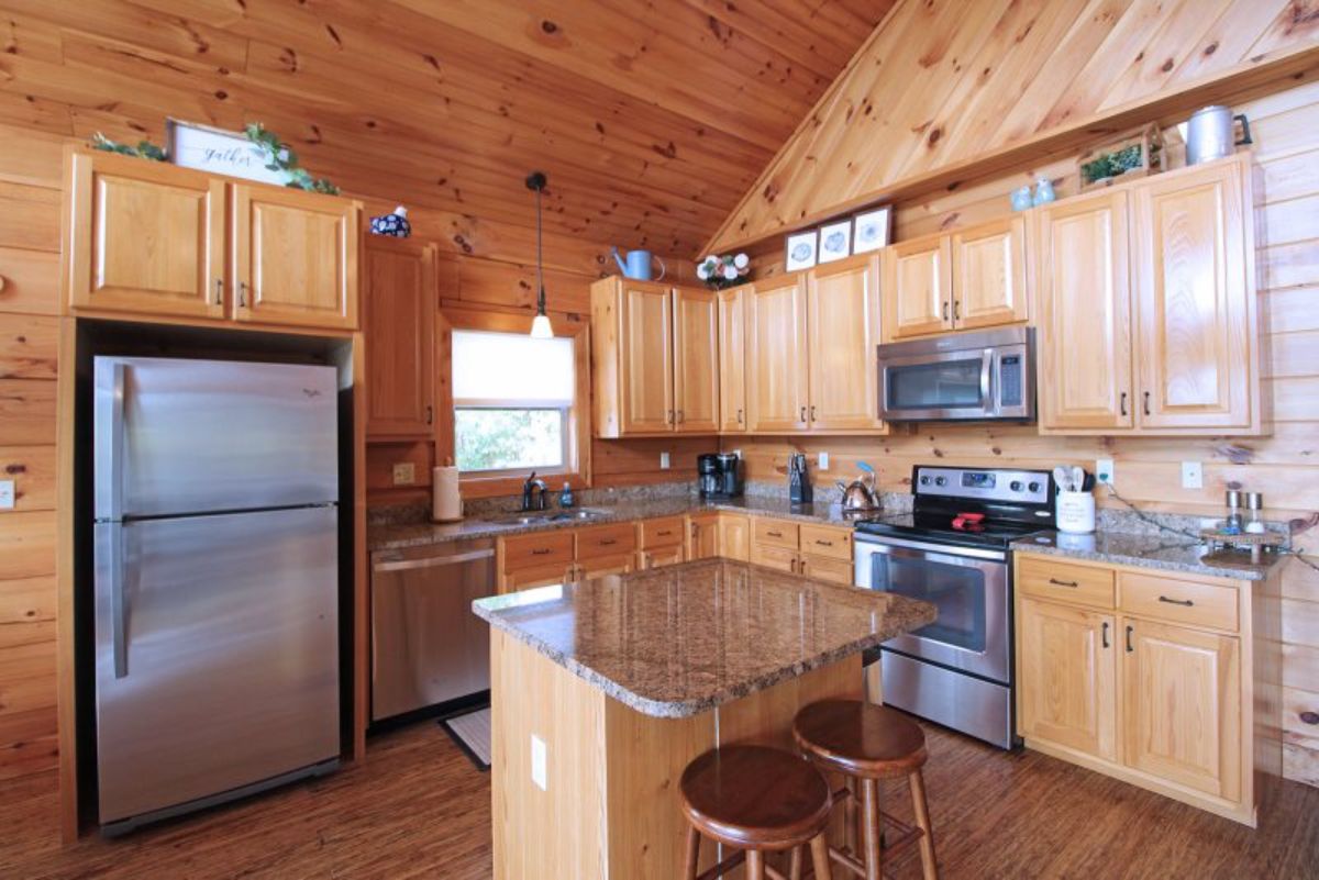 kitchen with light wood cabinets and stainless steel appliances