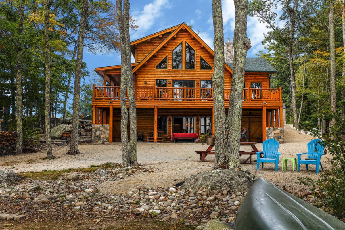 great room windows facing treeline on log cabin