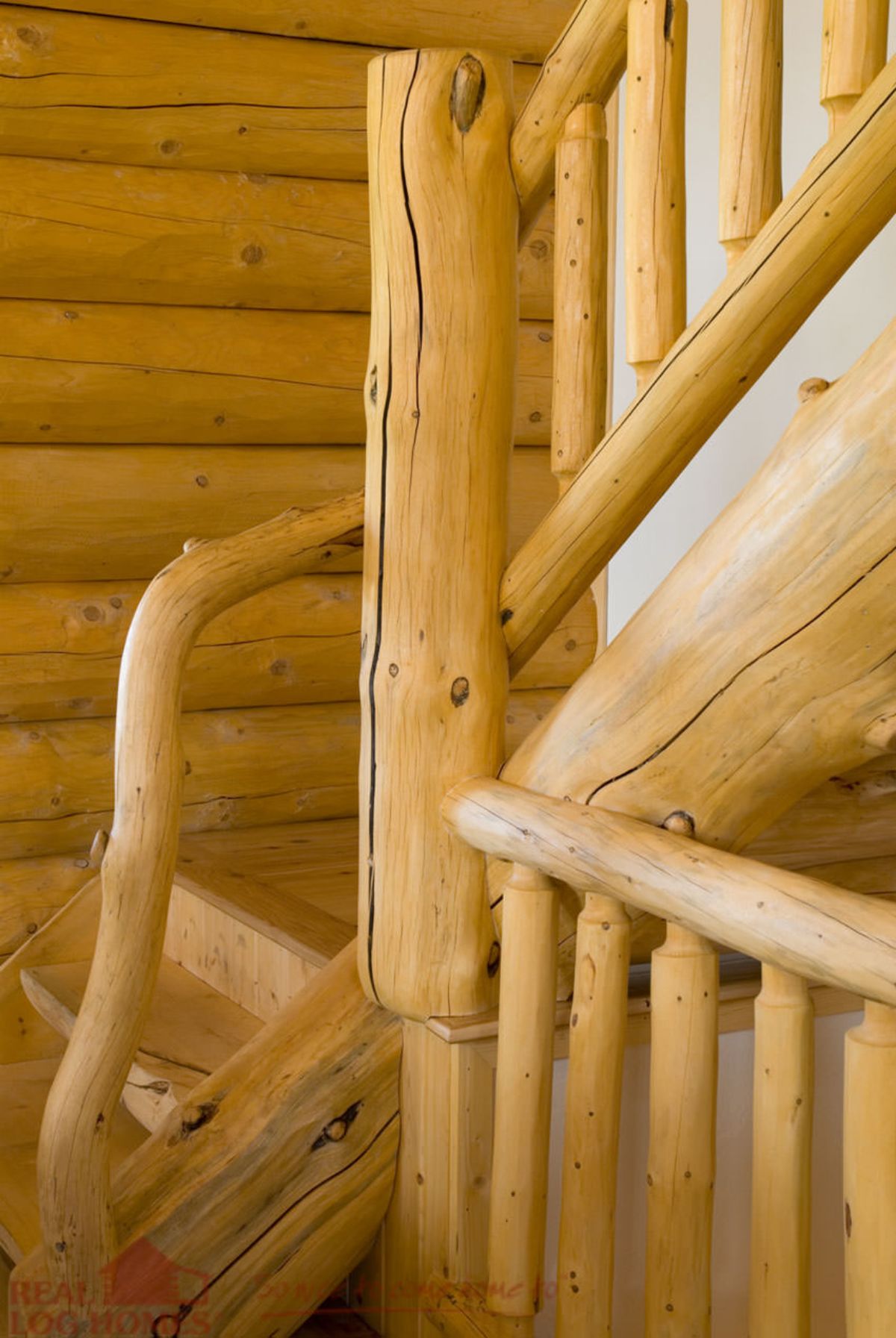 light natural wood railing on stairs in log cabin