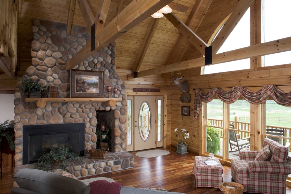 stone fireplace against wall with front door to right