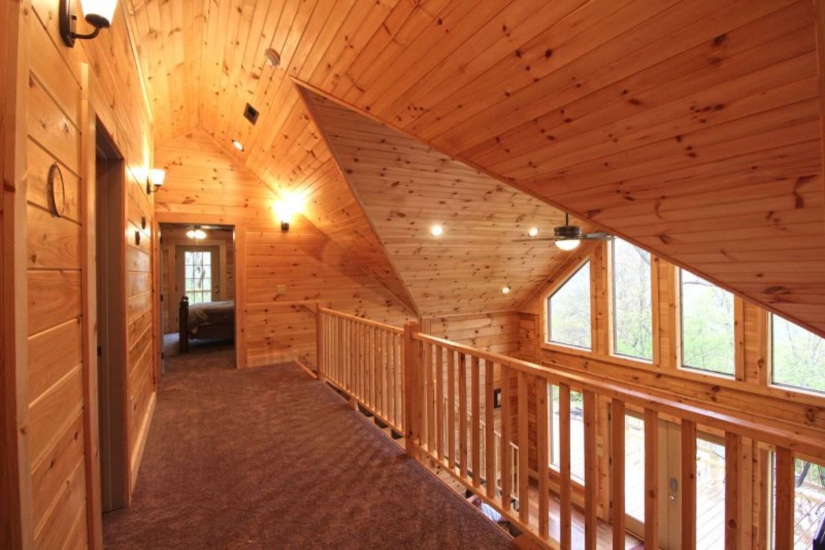 Open landing on lofted floor with log spindles