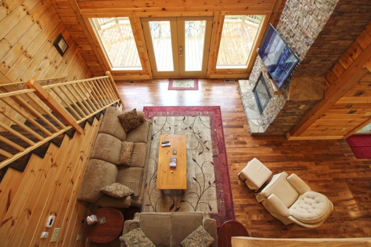 view from loft down into living room of log cabin