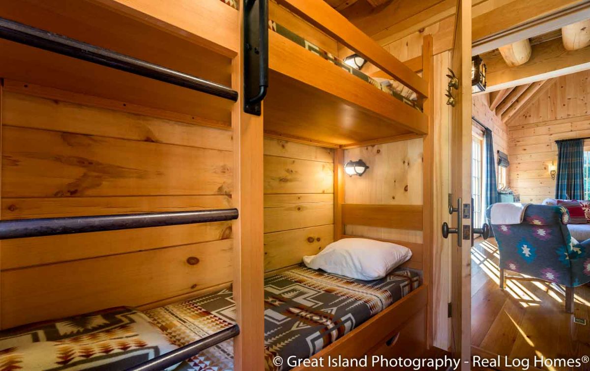 rustic blanket on bottom bunk in bedroom