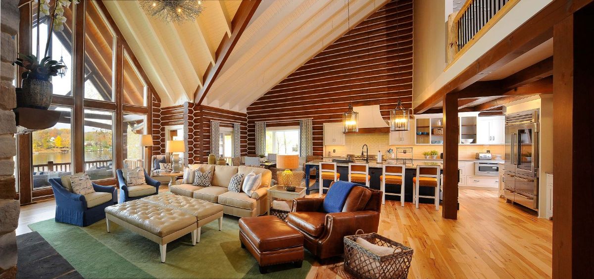 brown leather chair in living room foreground with kitchen in background