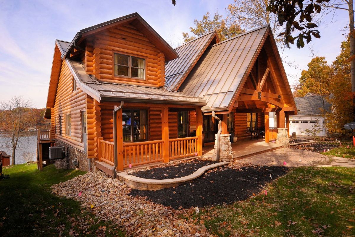front of log cabin with partial covered porch