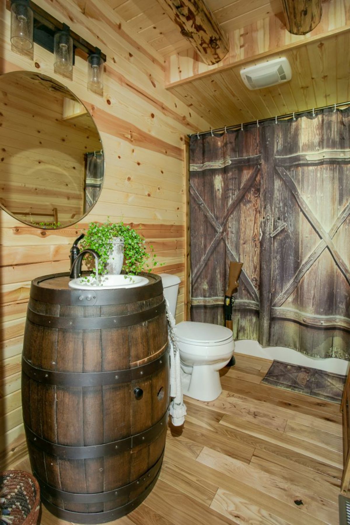 whiskey barrel sink under round mirror