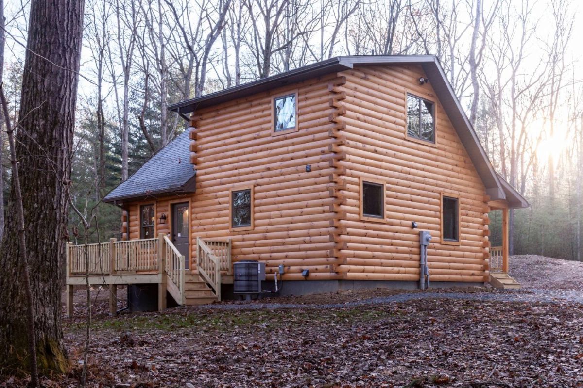 back side of log cabin showing open deck