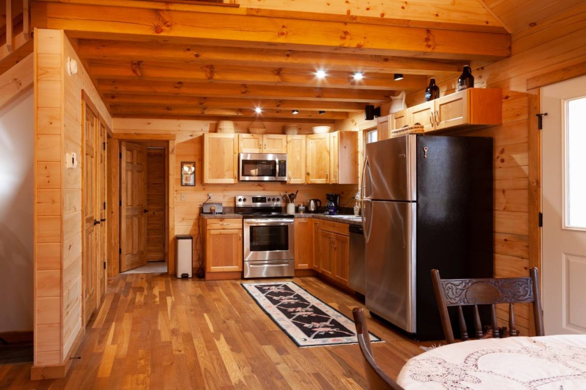 kitchen of log cabin with stainless steel stove