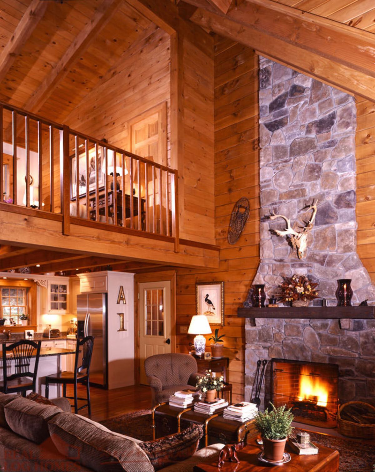 stone fireplace against wall of living area in cabin