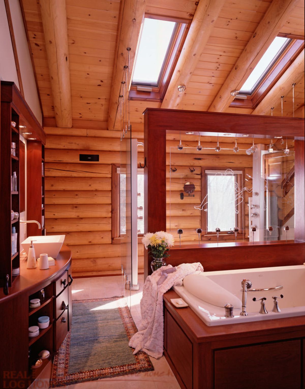 white soaking tub with wood frame under skylights