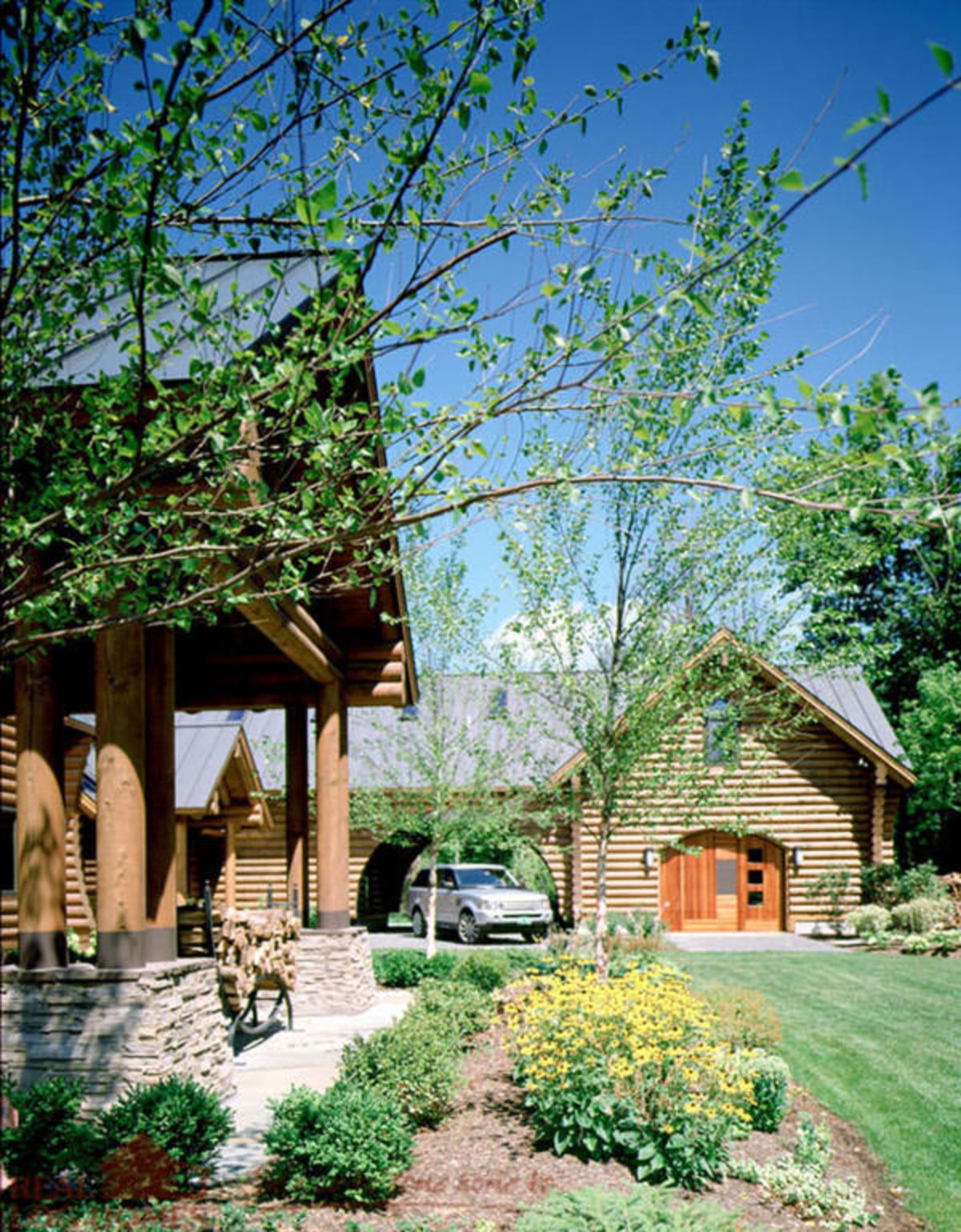 garage on back of image with covered porch in foreground