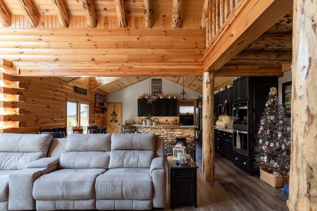 light gray sofa with view of kitchen behind