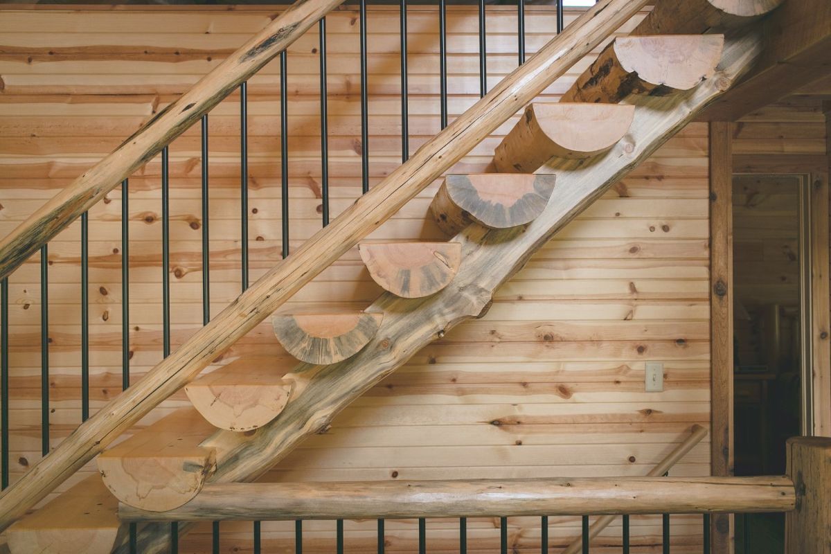log steps on stairs leading to loft level of home