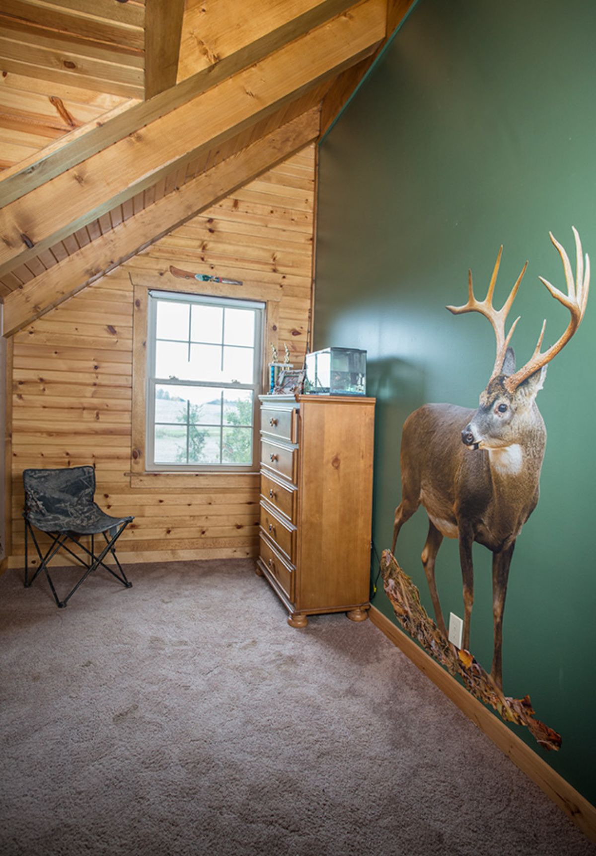 dark green wall with dear decal on right