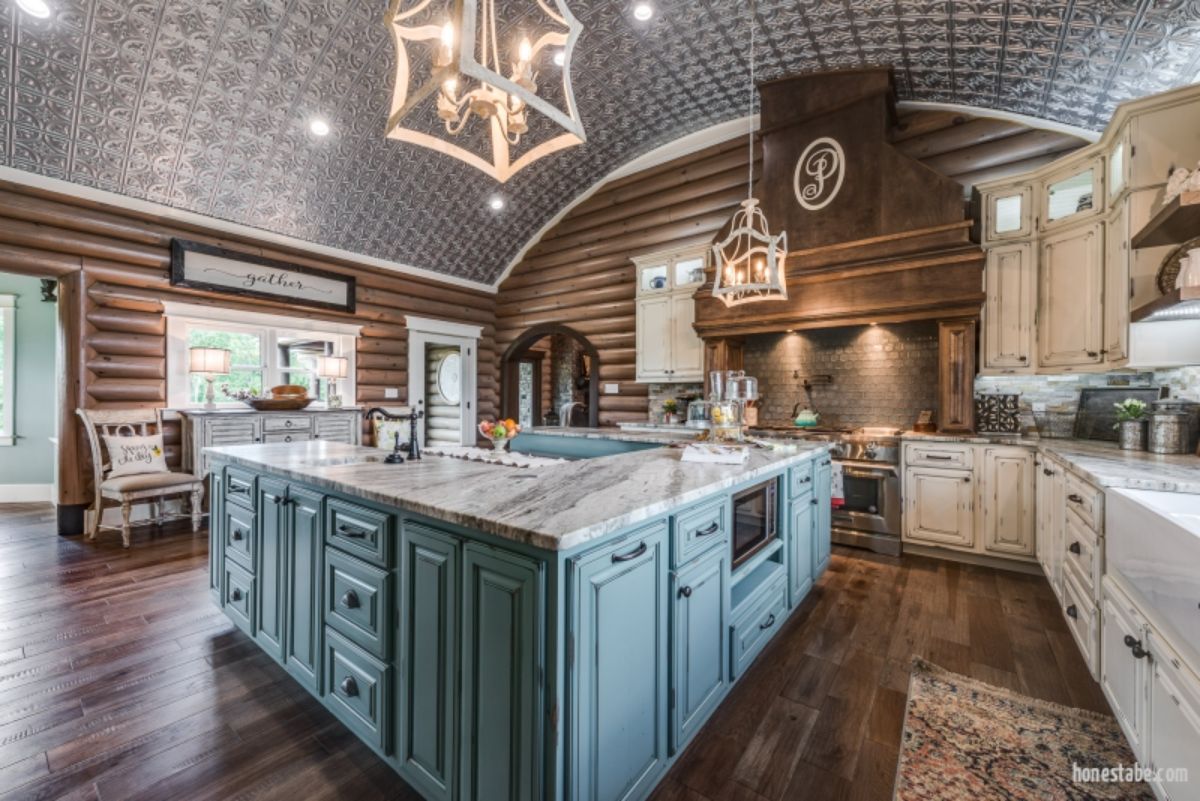 light blue wod cabinets underneath kitchen counter with arched tiled ceiling