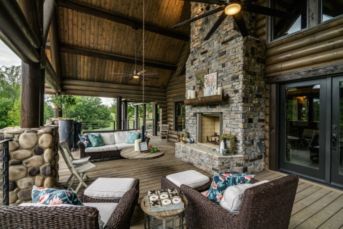 fireplace under deck on back of cabin