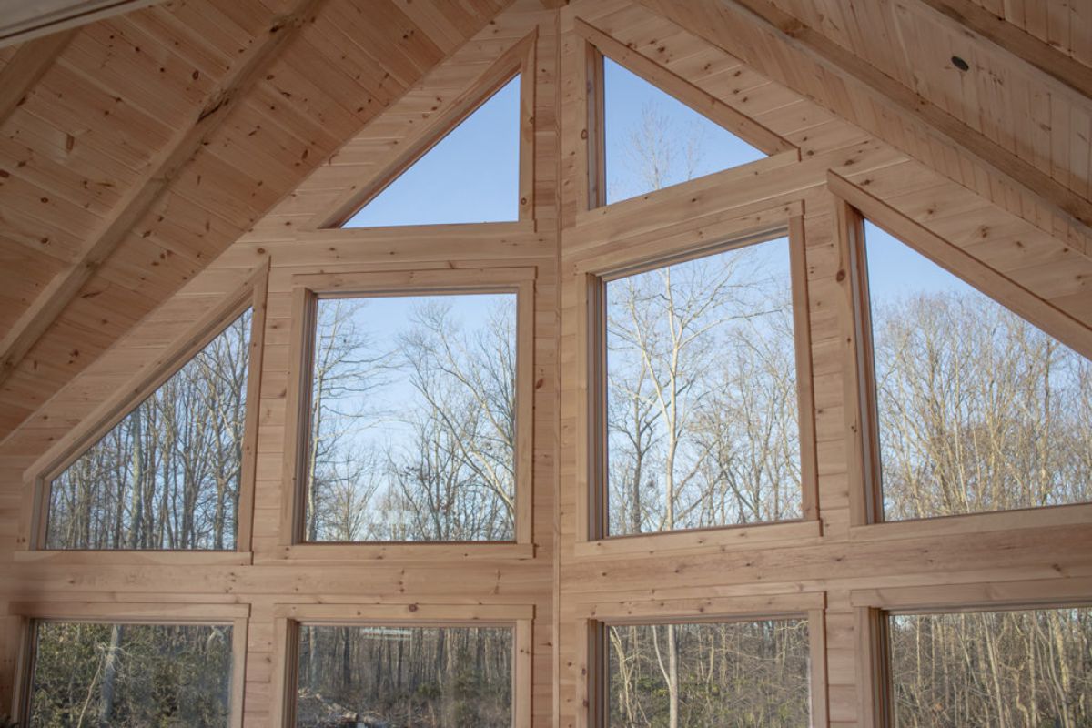 wall of windows with light wood interior