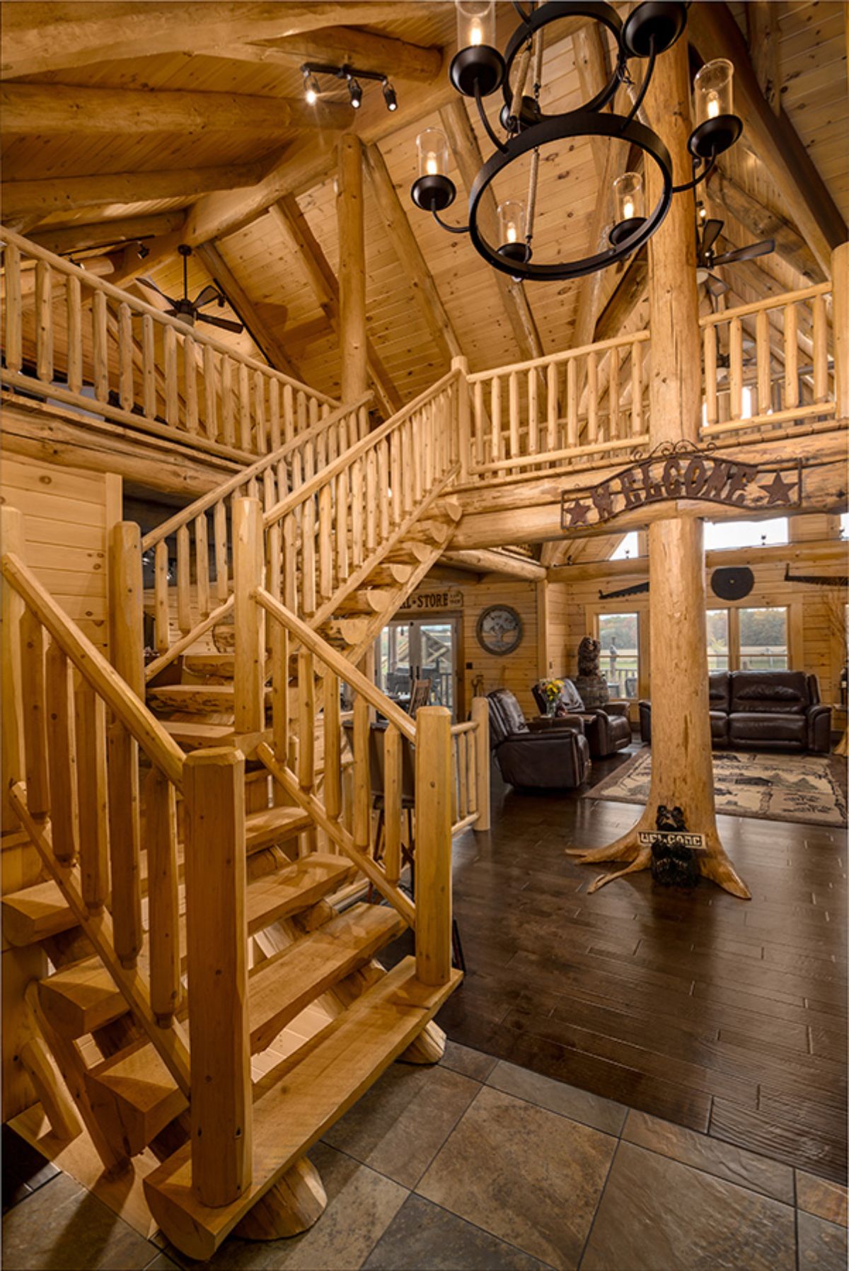 stairs on left leading to loft with living room to right background